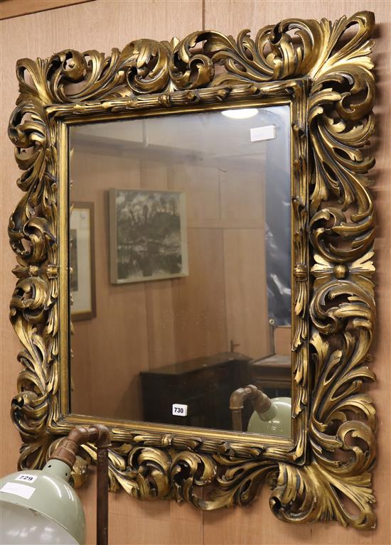 A gilt scroll frame wall mirror W.90cm
